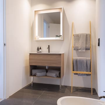 a bathroom with a mirror and sink