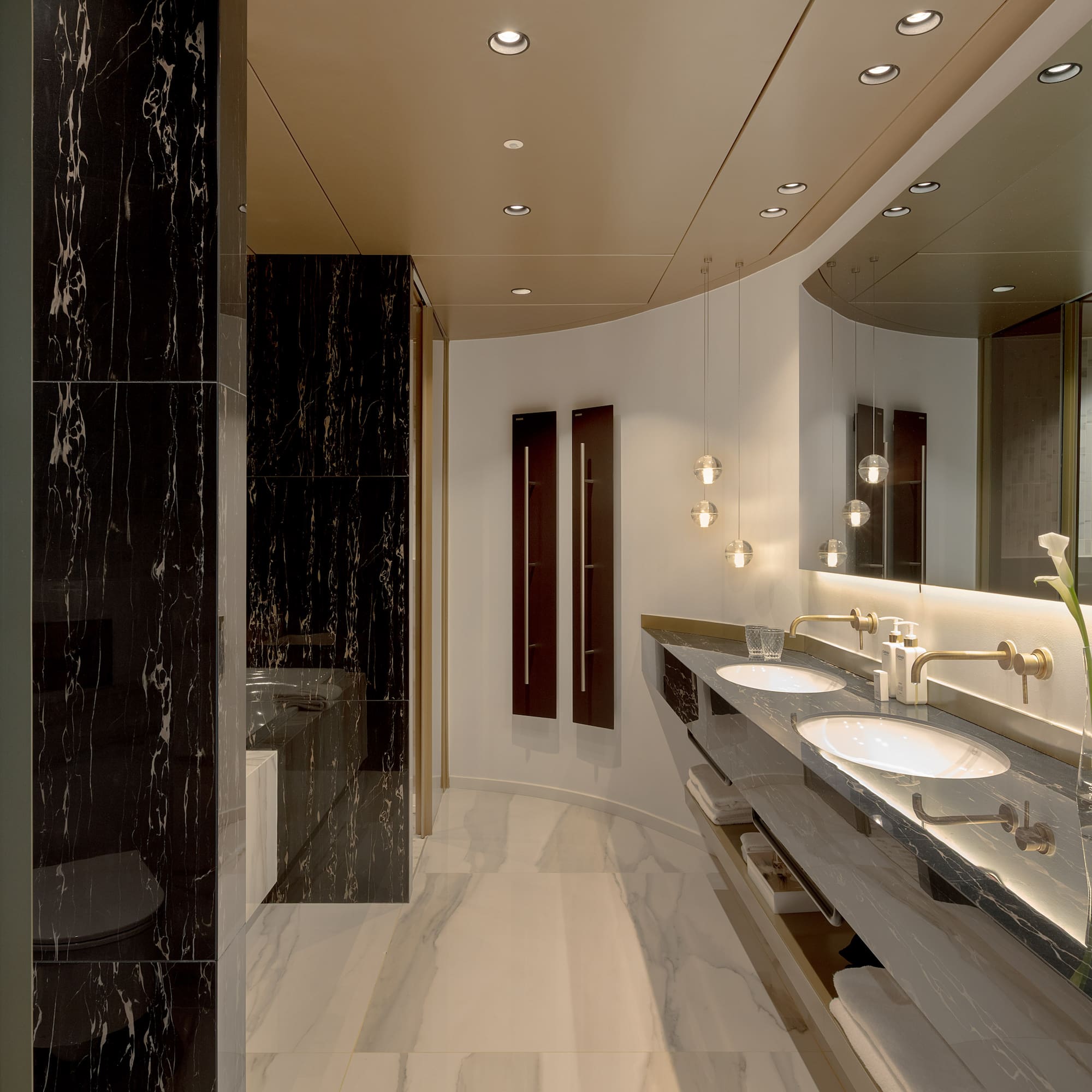 a bathroom with marble floor and marble walls