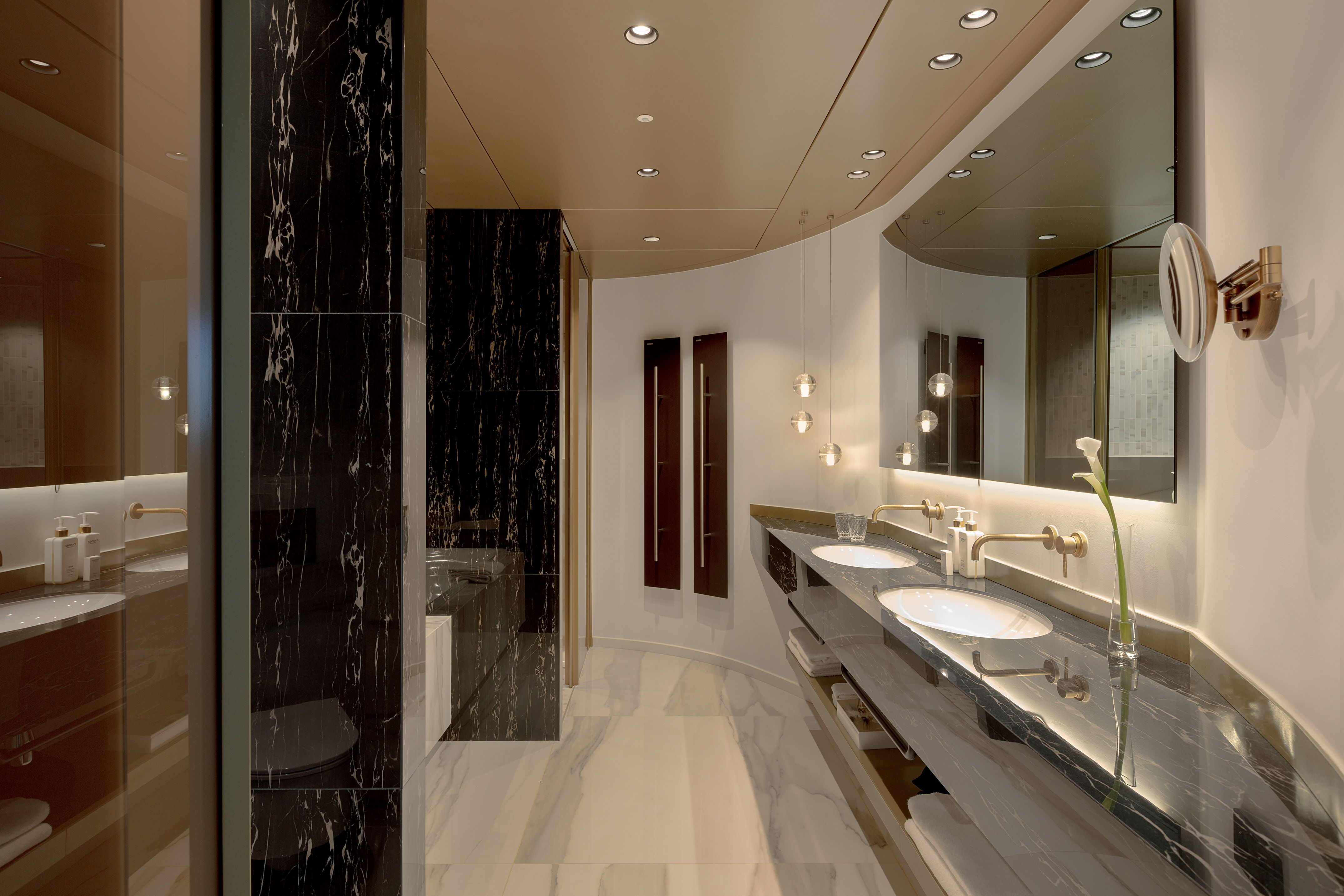 a bathroom with marble floor and marble walls