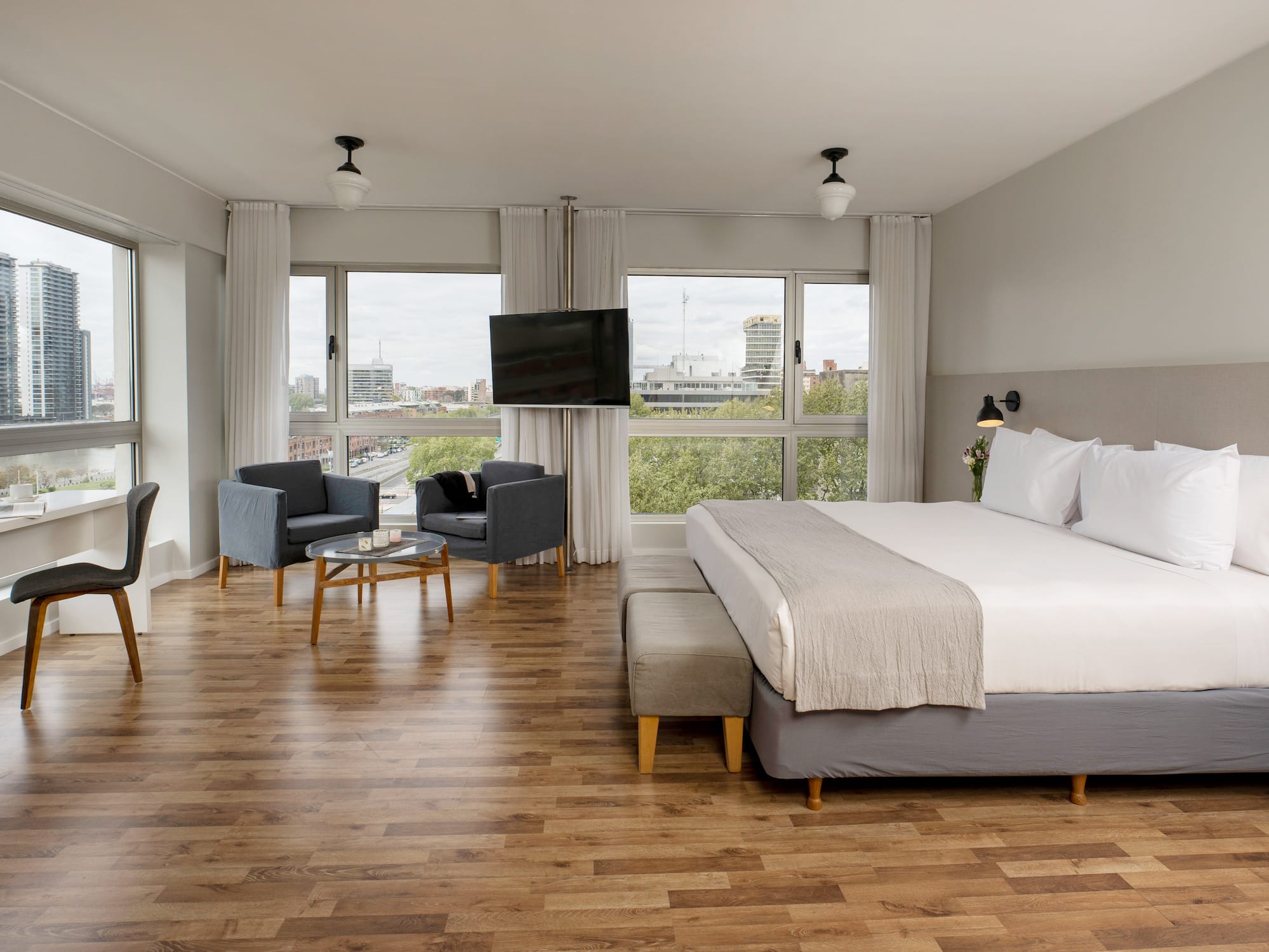 a bedroom with a large bed and a television.