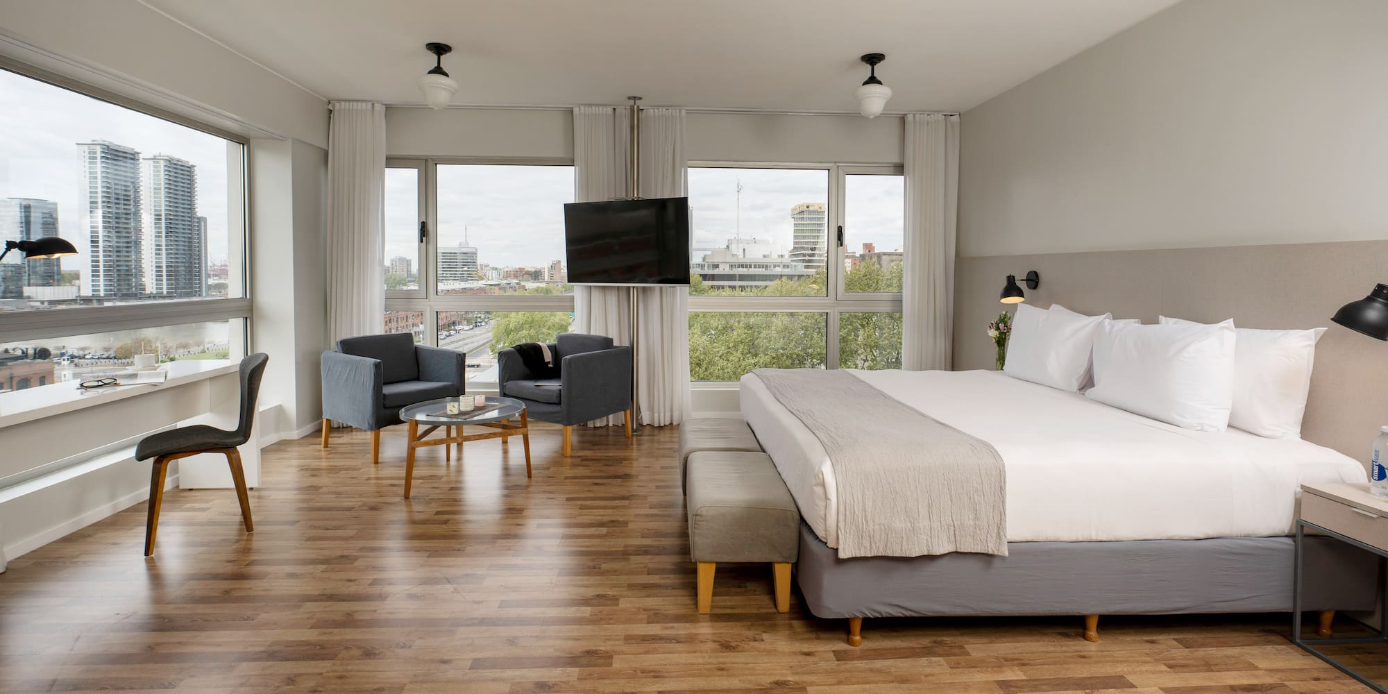 a bedroom with a large bed and a television.