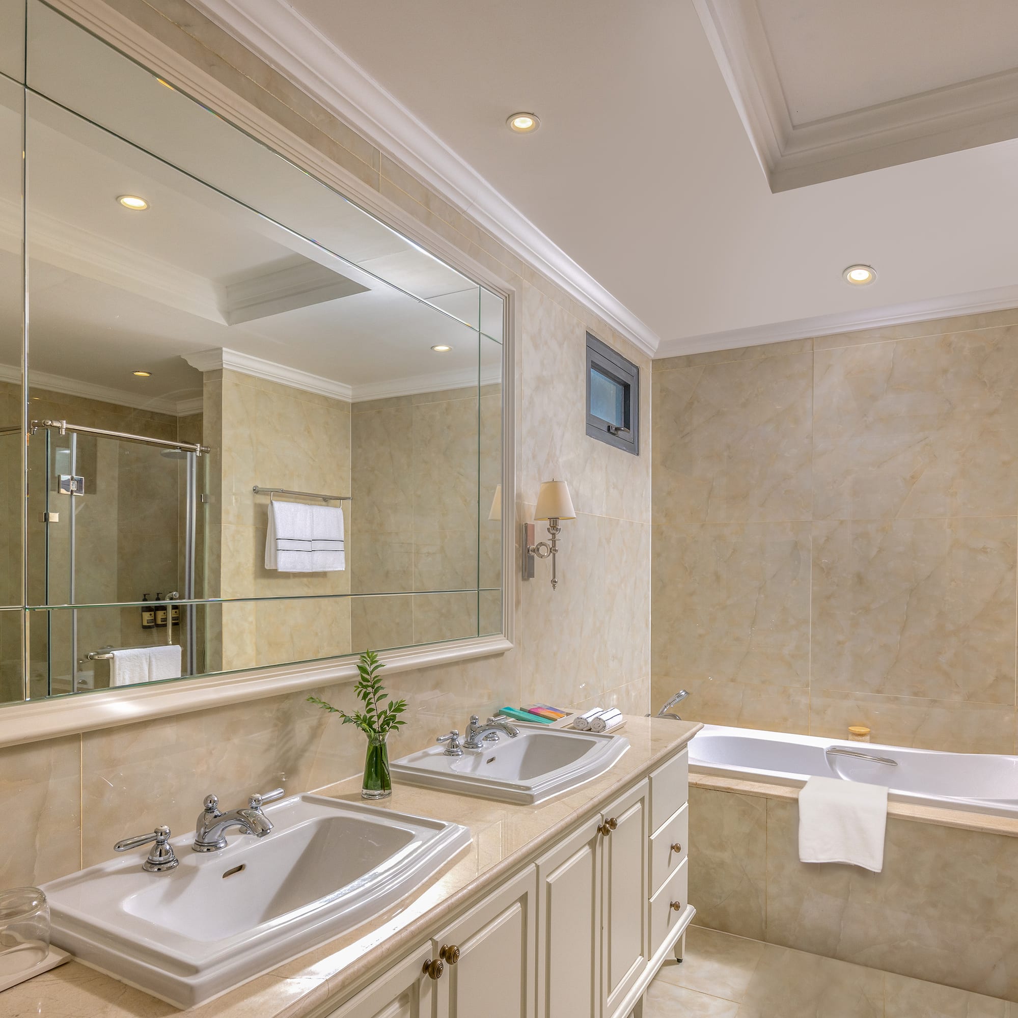 a bathroom with a large mirror and sink