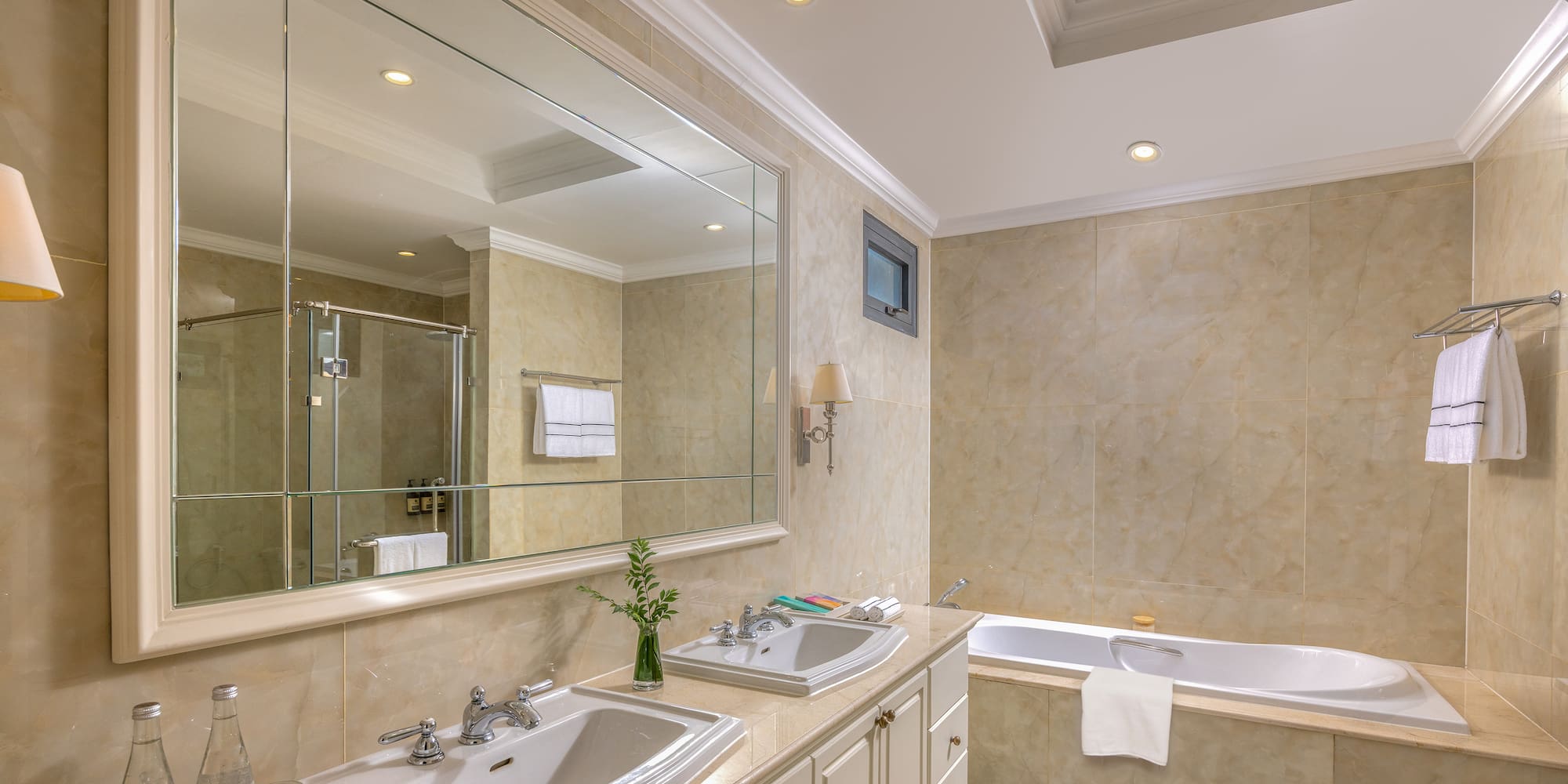 a bathroom with a large mirror and sink