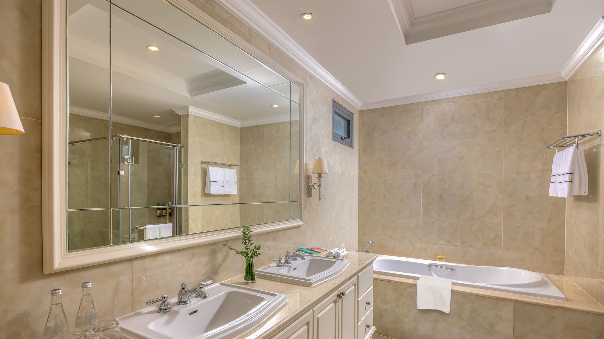 a bathroom with a large mirror and sink