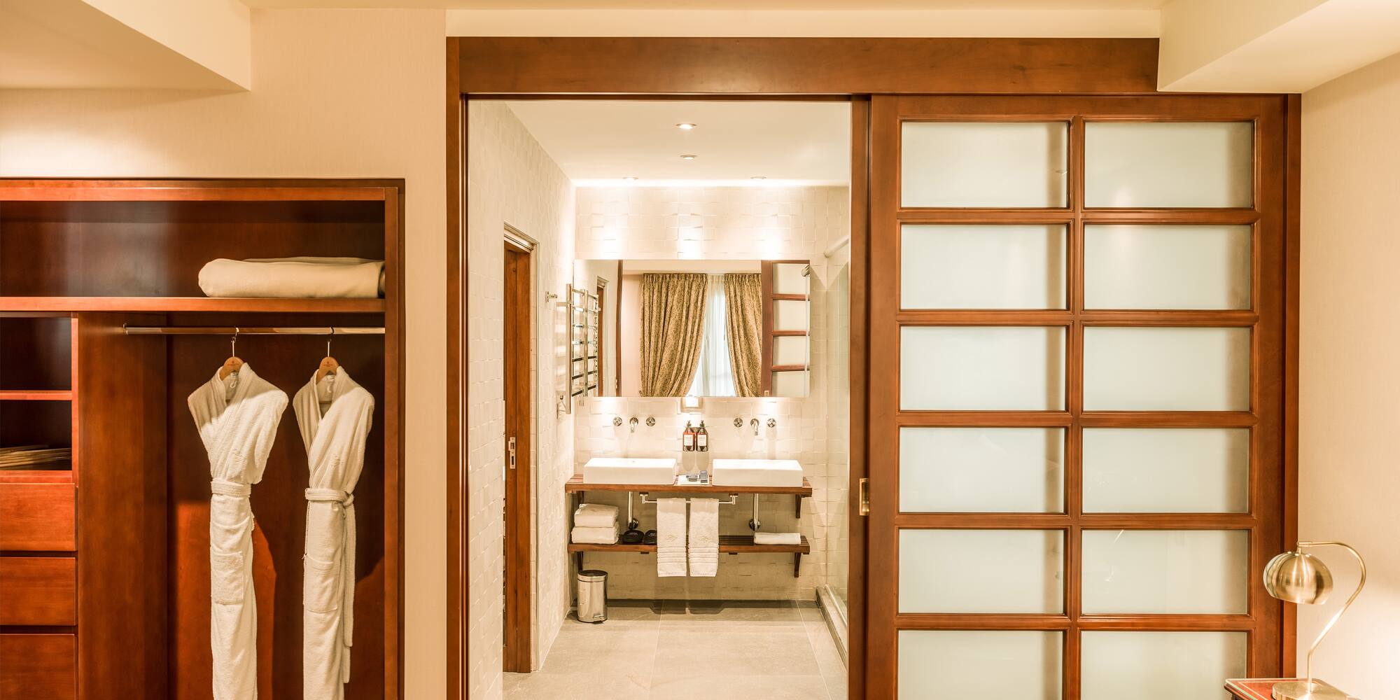 a room with a closet door and a mirror