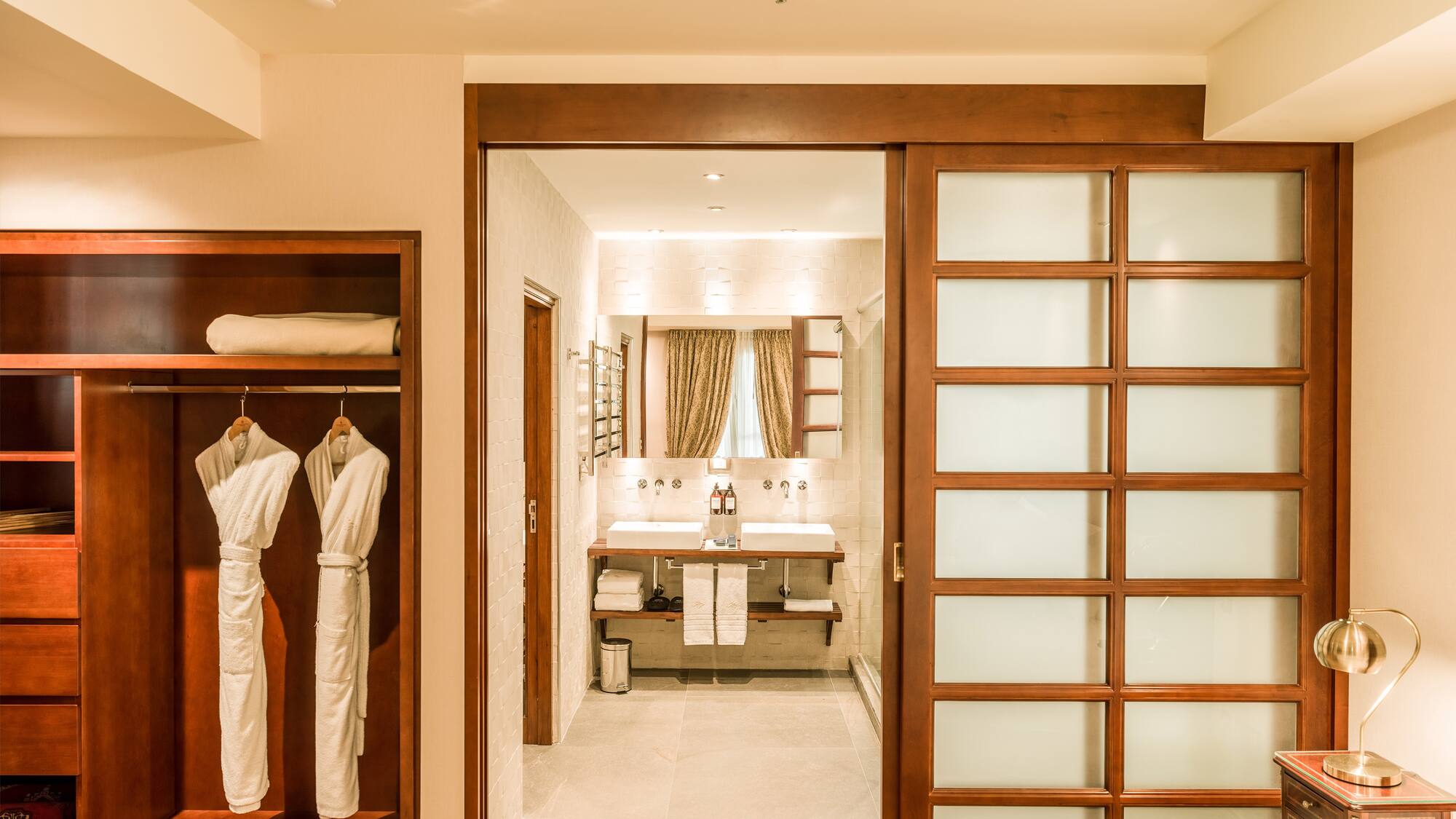 a room with a closet door and a mirror