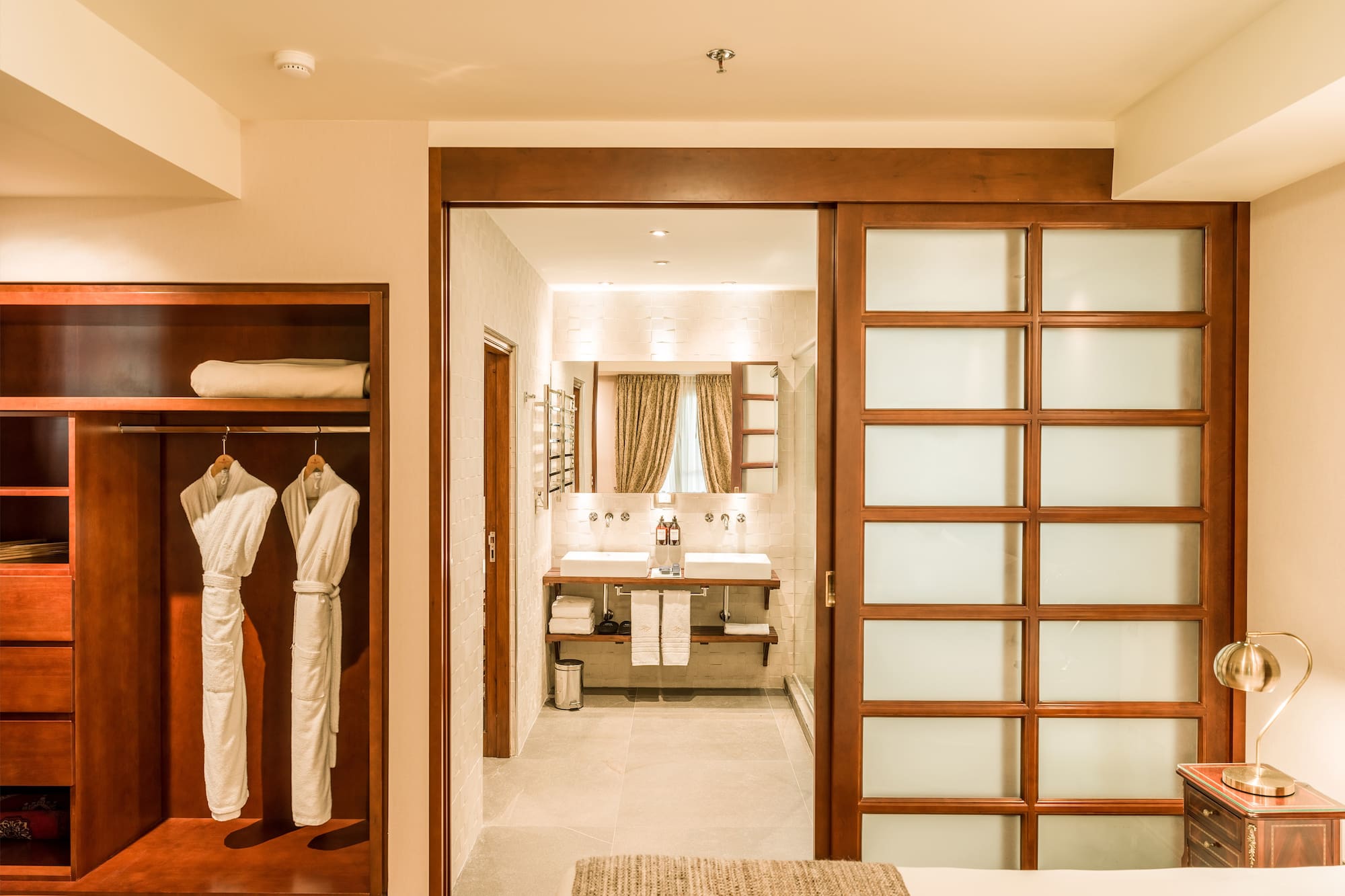 a room with a closet door and a mirror