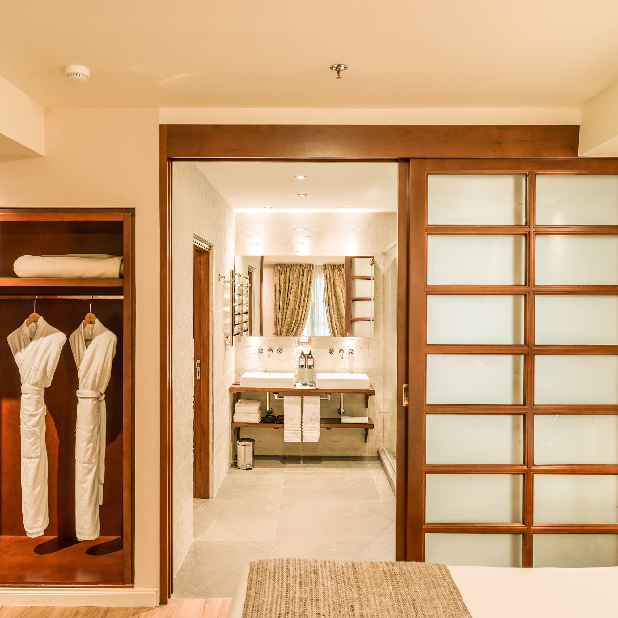 a room with a closet door and a mirror