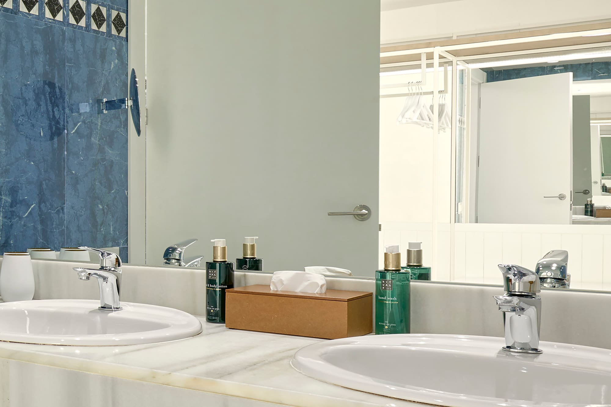 a bathroom with sinks and a mirror