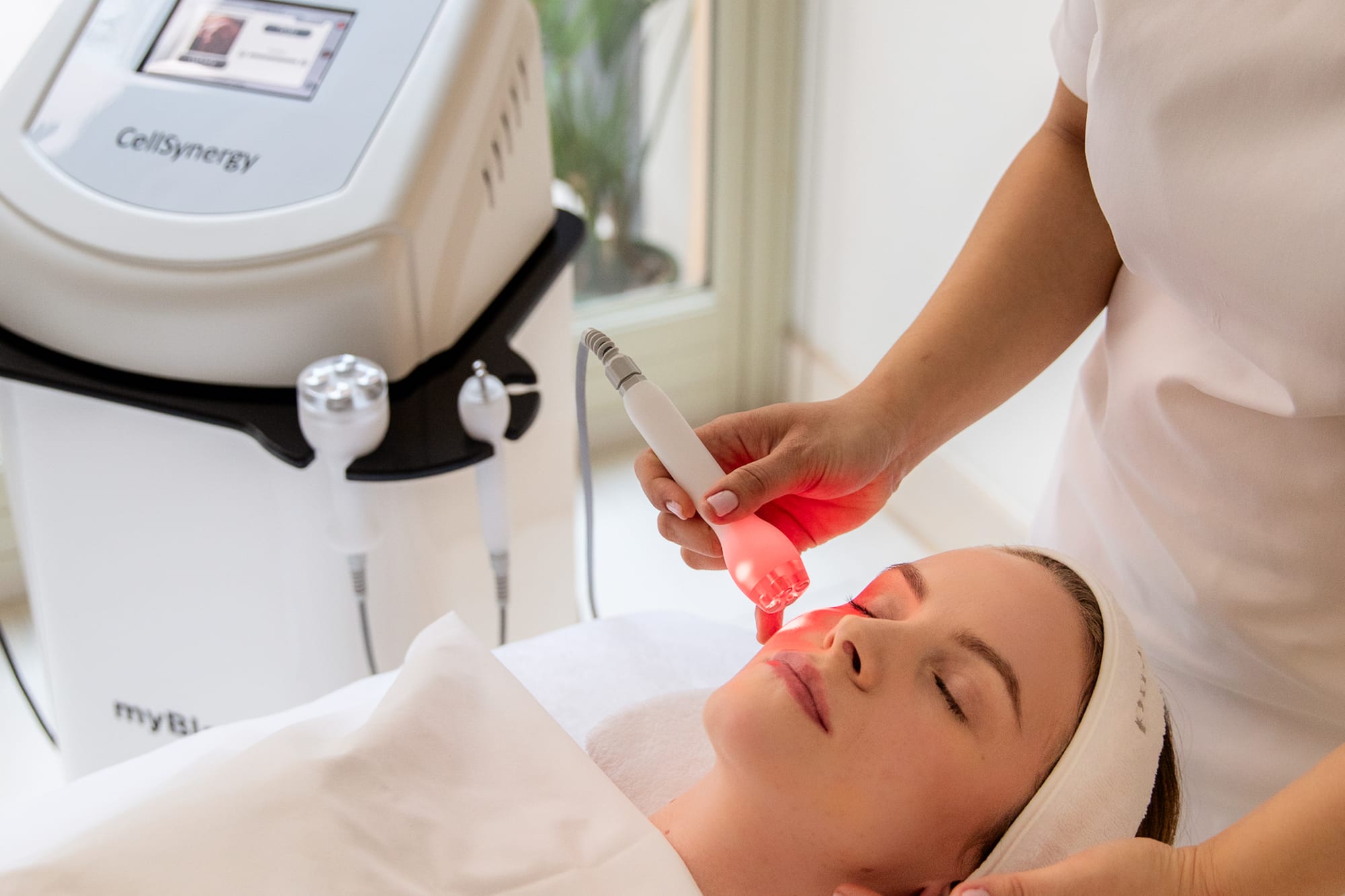 a woman receiving a face massage