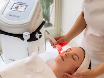 a woman receiving a face massage