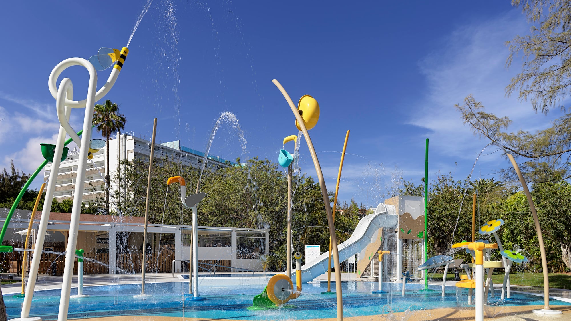 a water park with a slide and a slide