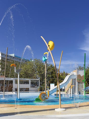 a water park with a slide and a slide