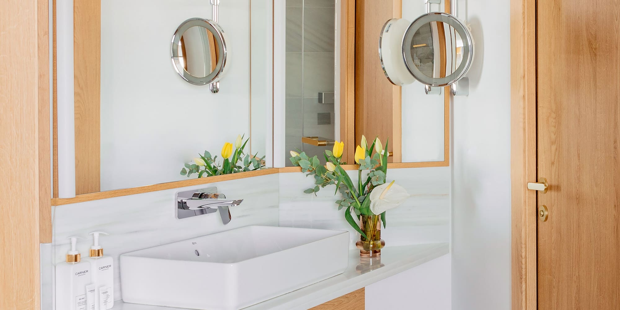 a bathroom with a sink and mirror