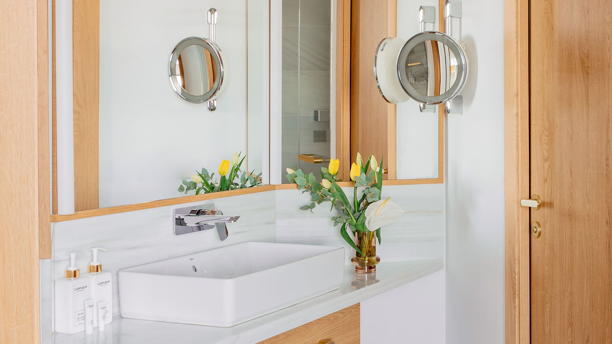 a bathroom with a sink and mirror