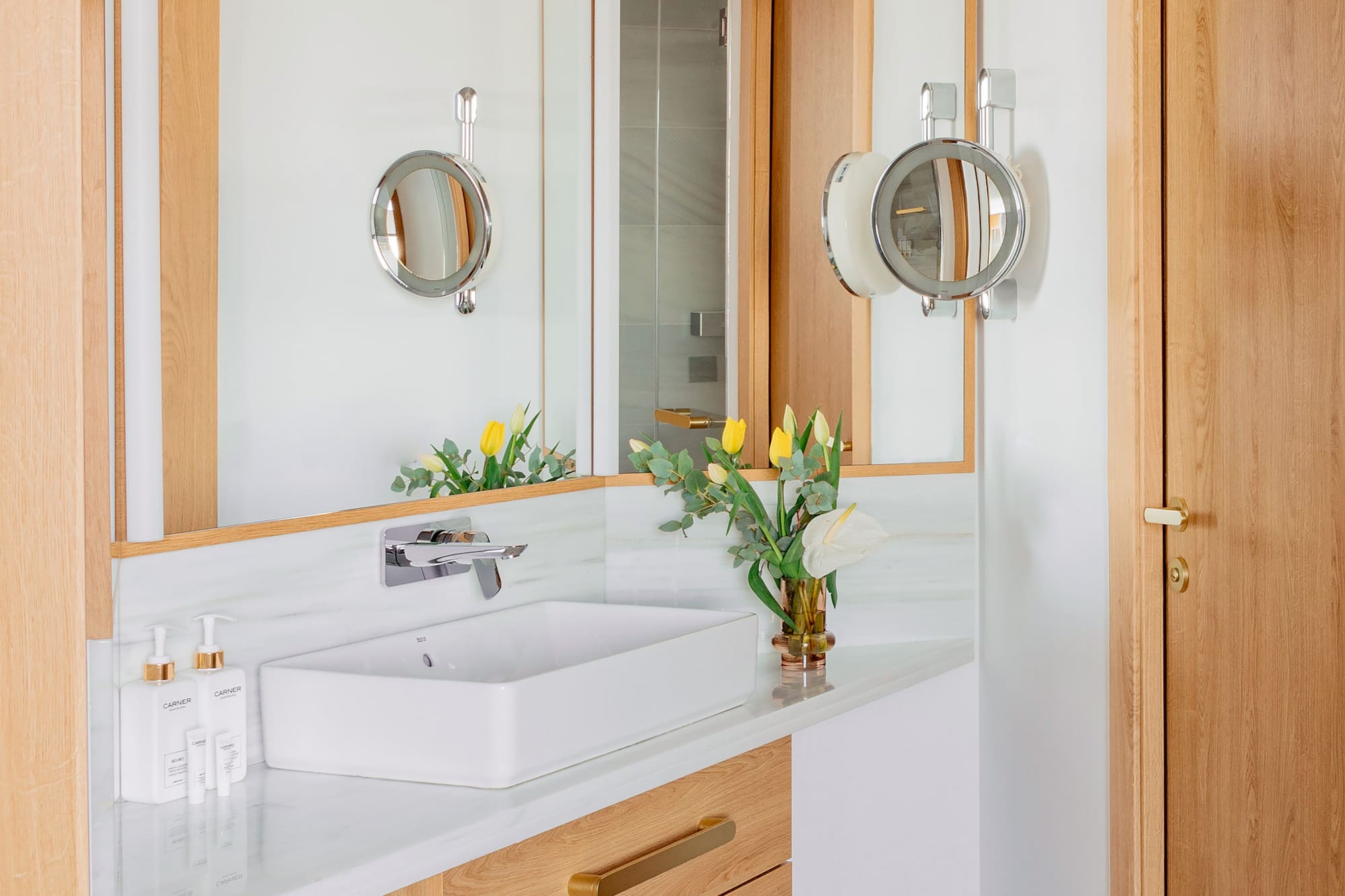 a bathroom with a sink and mirror