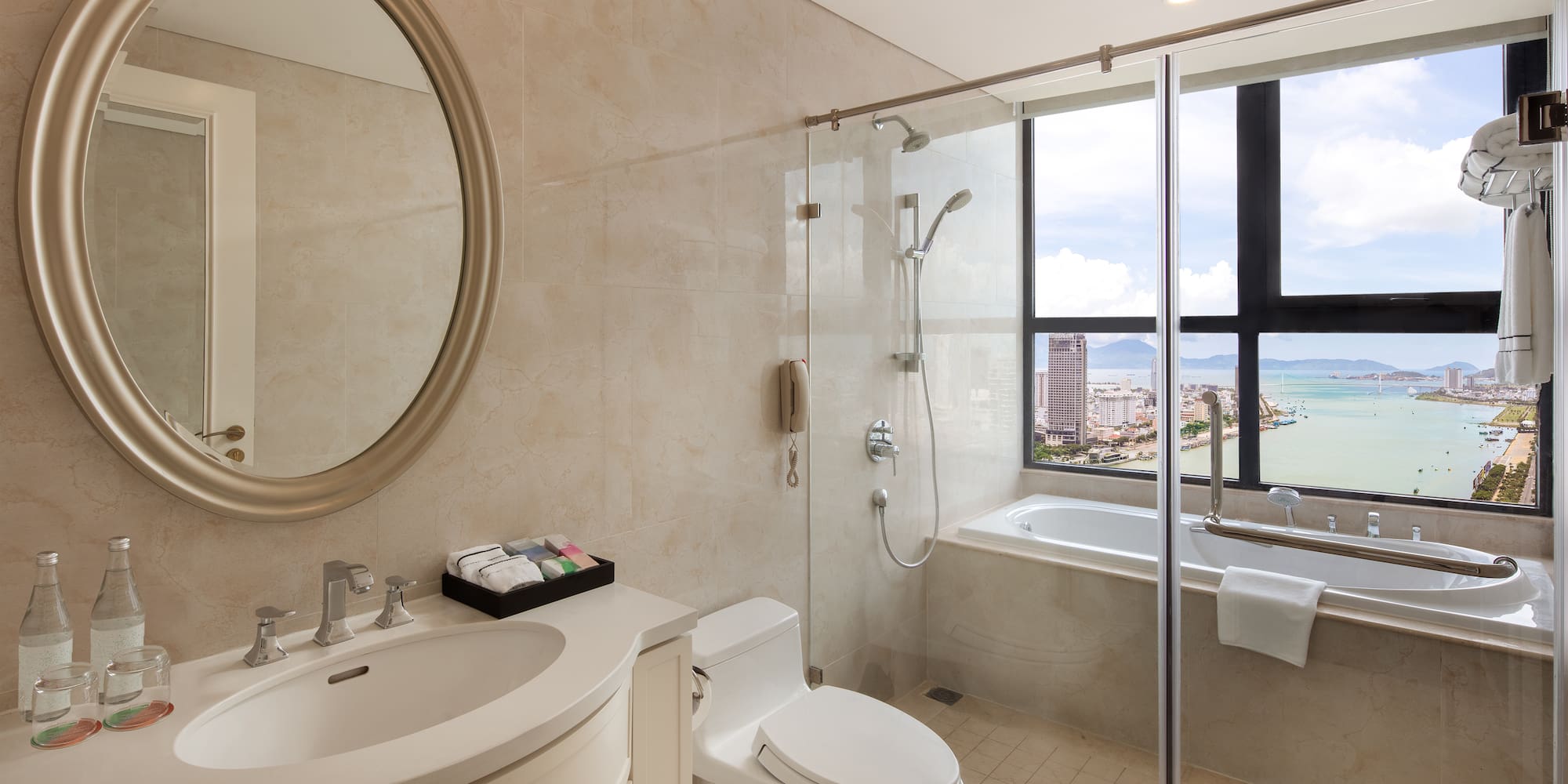 a bathroom with a glass shower door and a tub