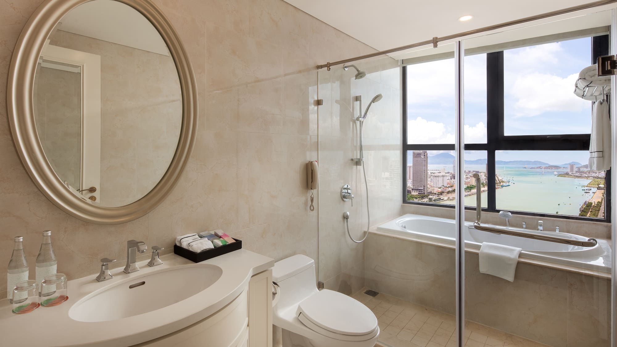 a bathroom with a glass shower door and a tub