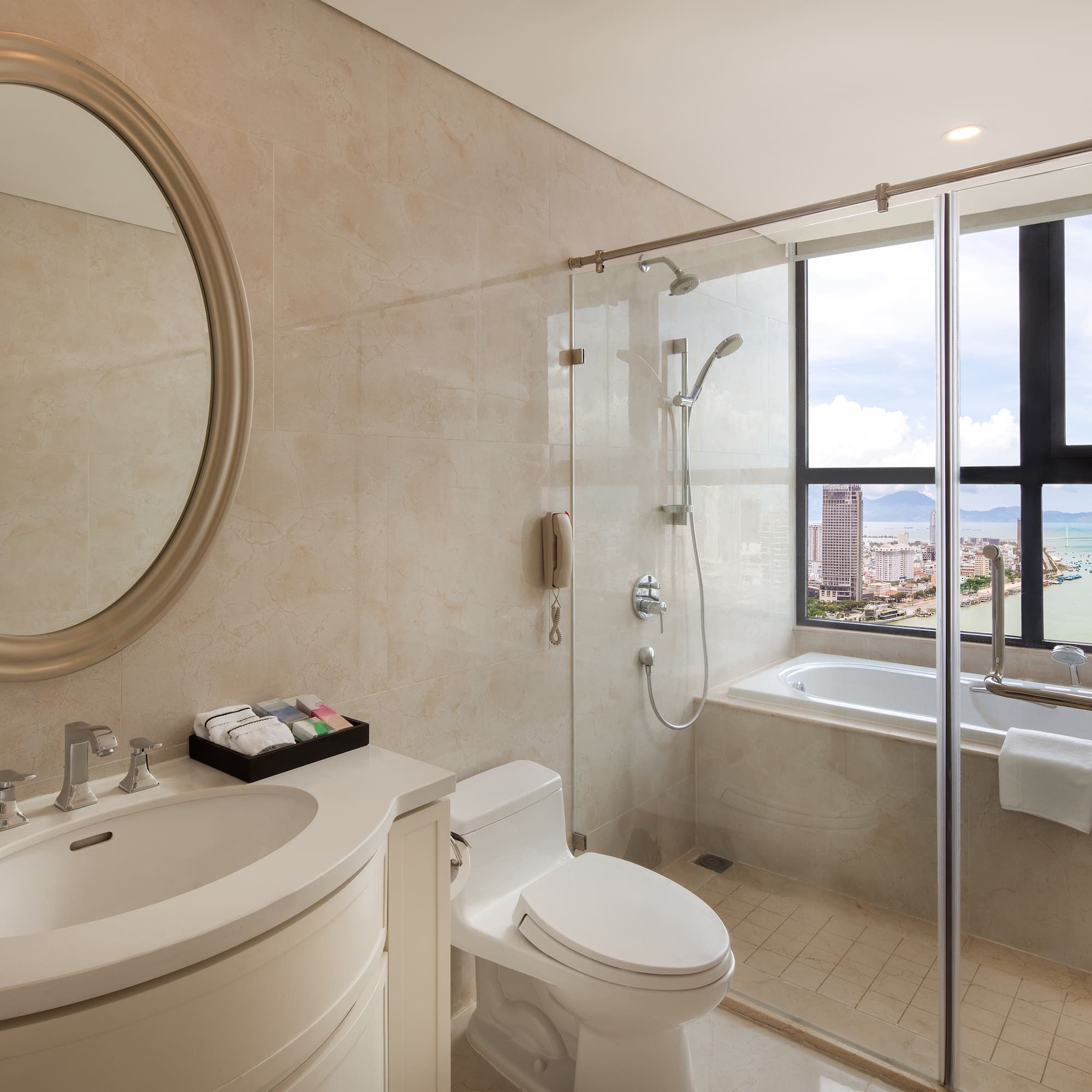 a bathroom with a glass shower door and a tub
