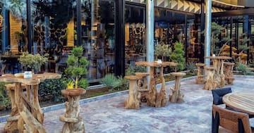 a table and chairs outside a building
