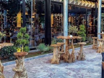 a table and chairs outside a building