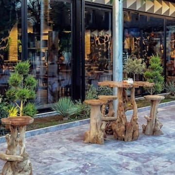 a table and chairs outside a building