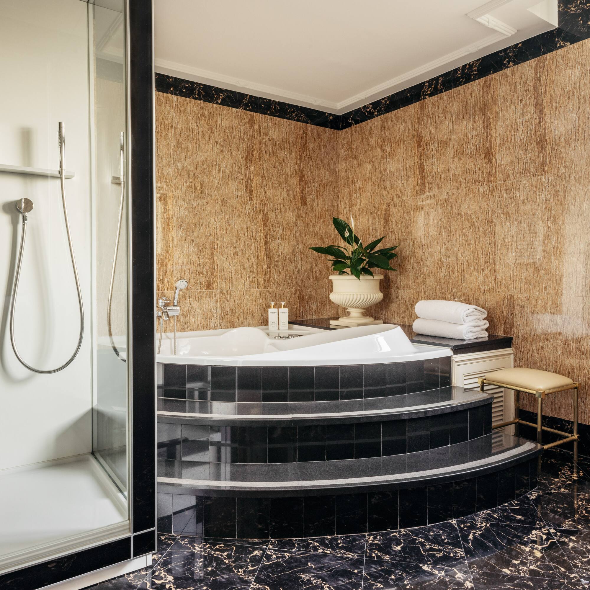a bathroom with a tub and shower