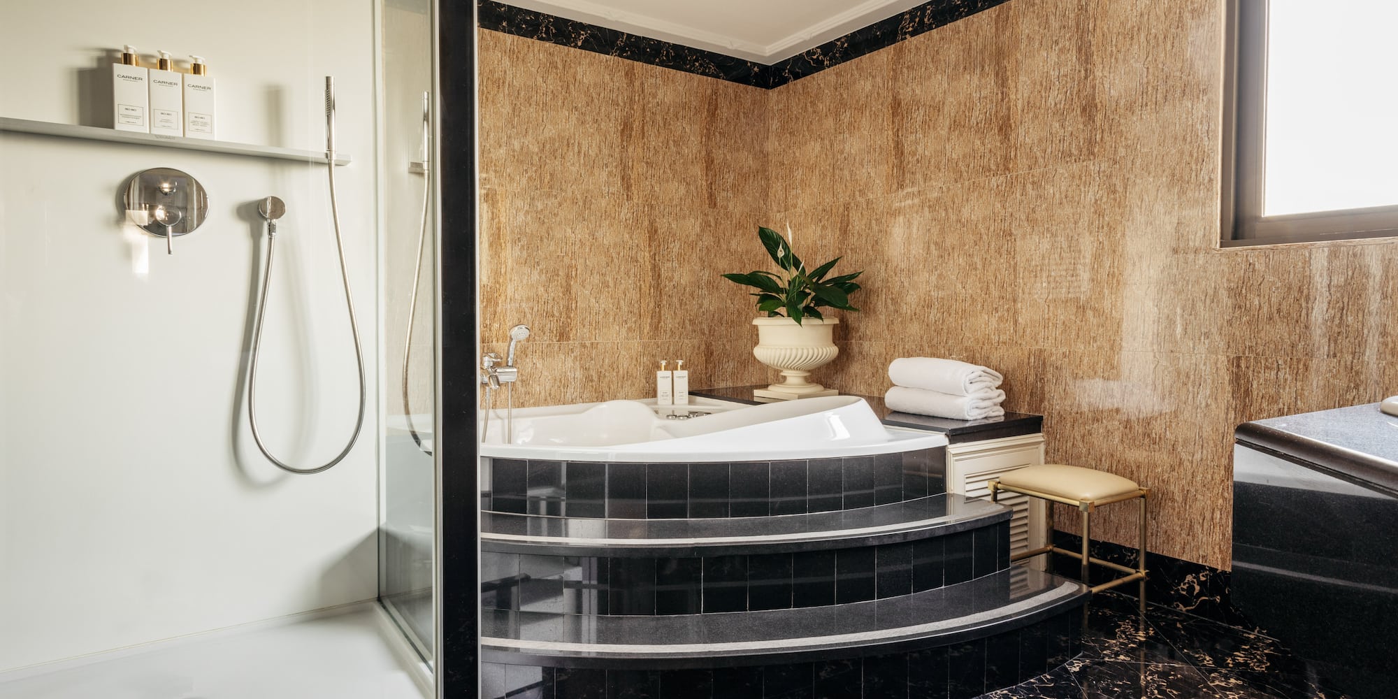 a bathroom with a tub and shower