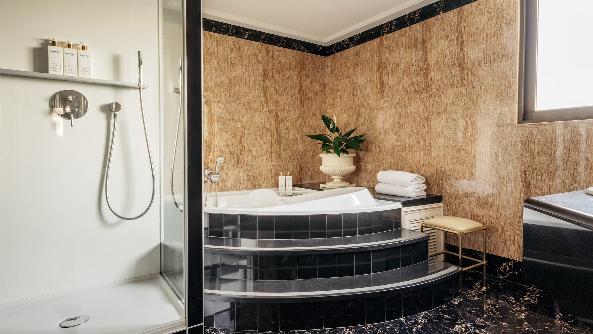 a bathroom with a tub and shower