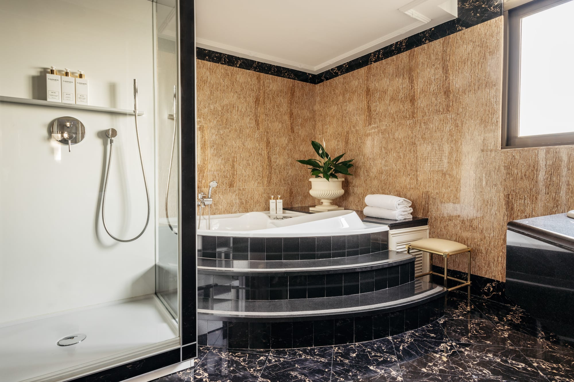 a bathroom with a tub and shower