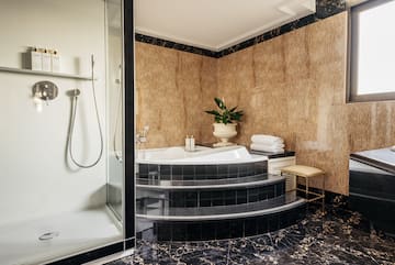 a bathroom with a tub and shower
