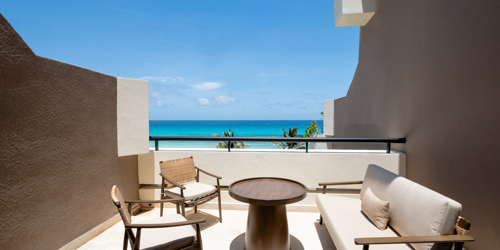 a patio with chairs and a table