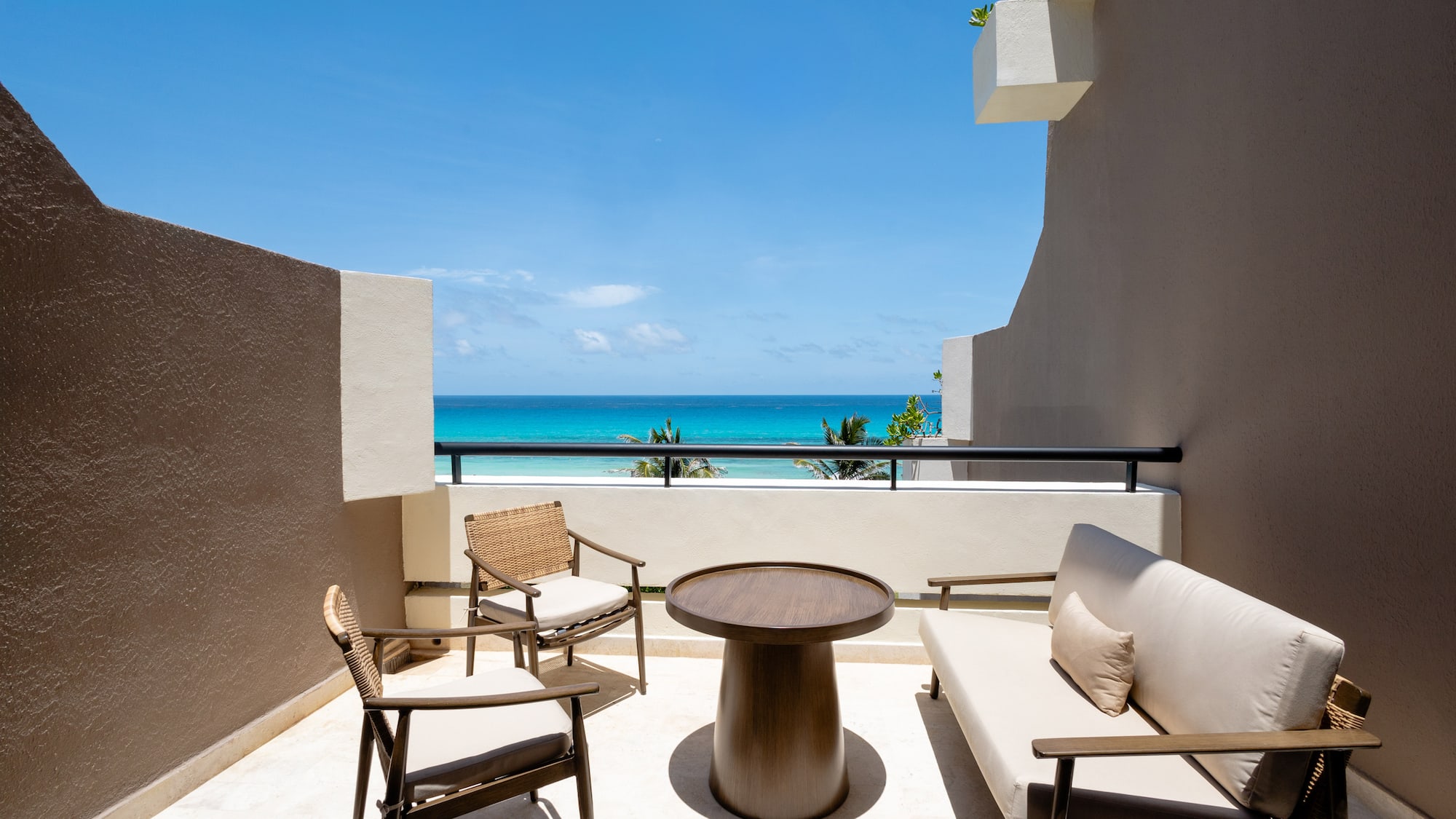 a patio with chairs and a table