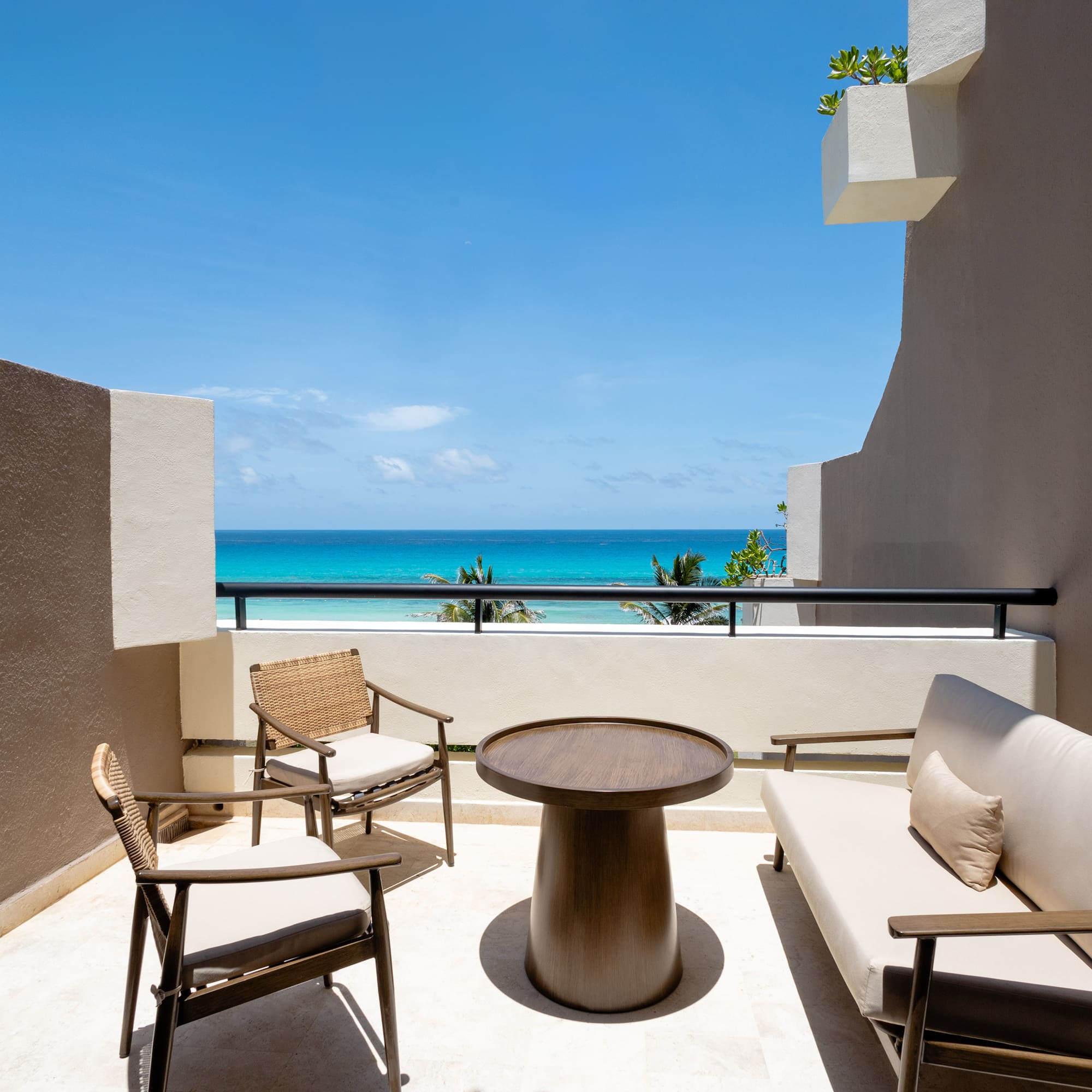 a patio with chairs and a table