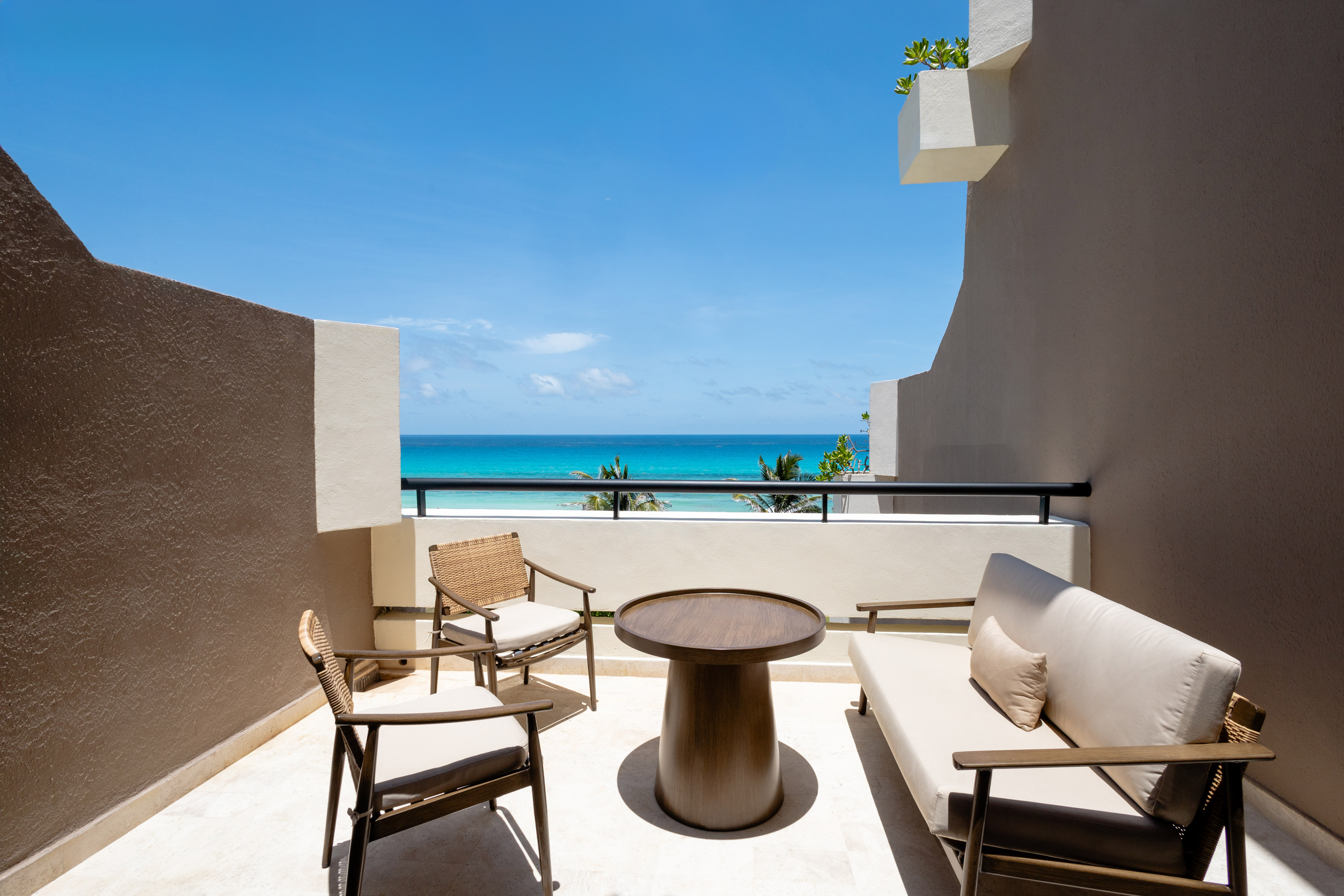 a patio with chairs and a table