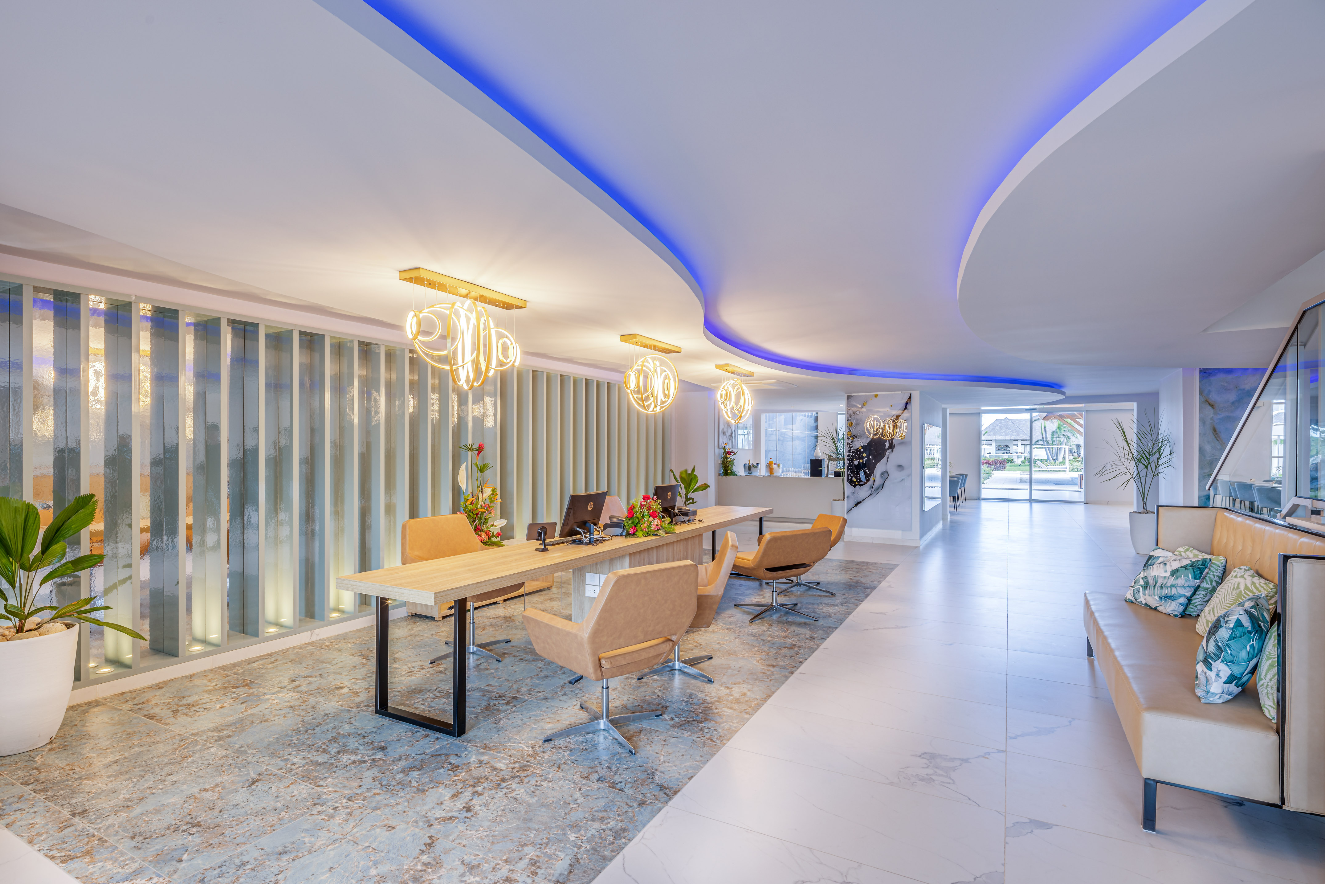 a room with a desk and chairs