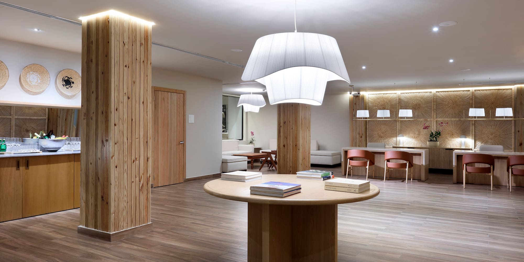 a room with a round table and chairs