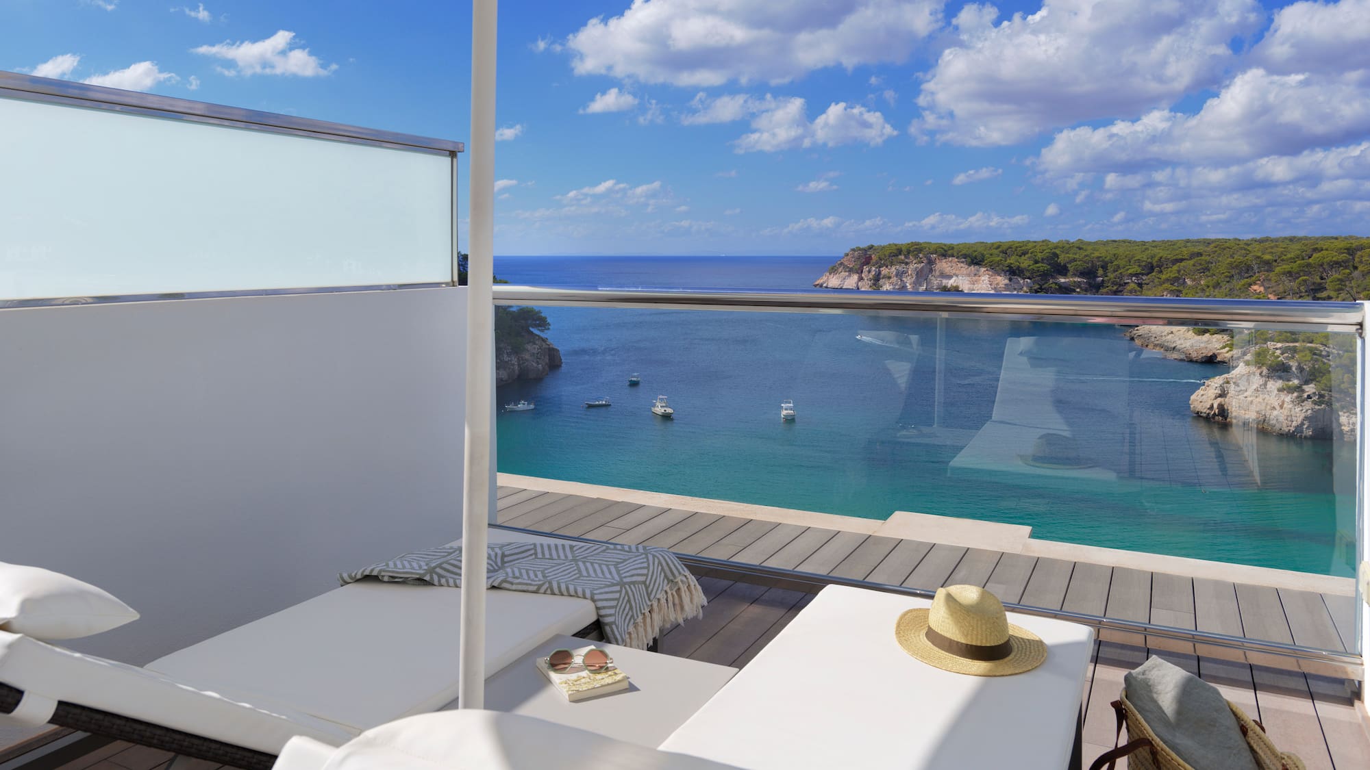 a deck with a pool and a beach view