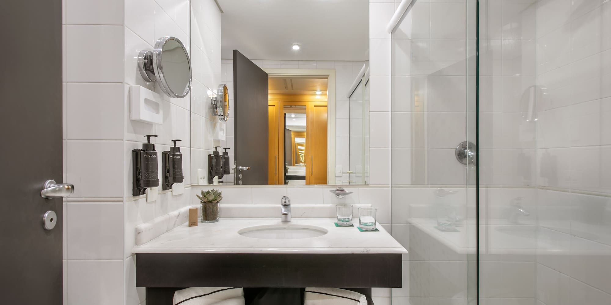 a bathroom with a mirror and a sink