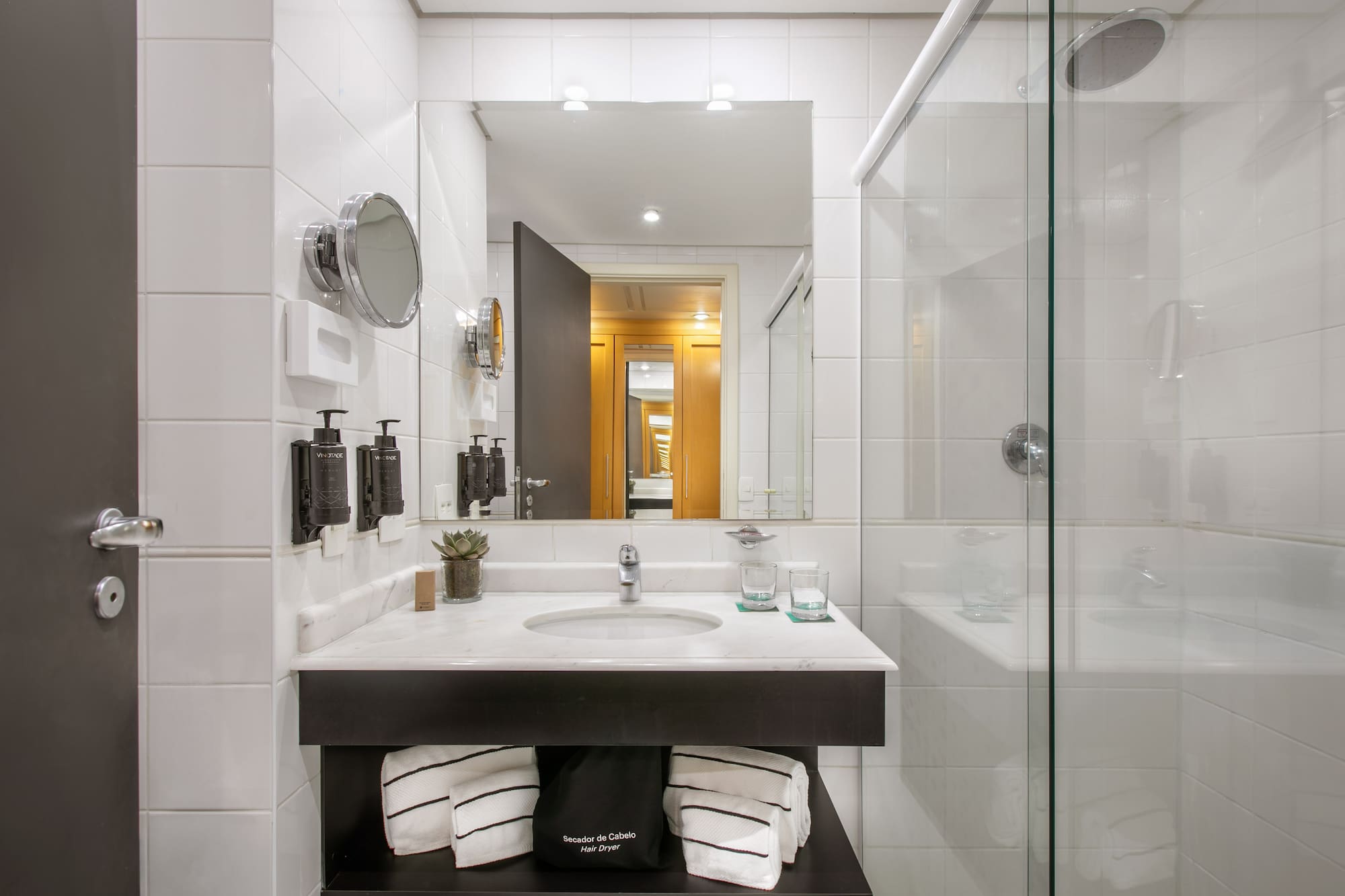 a bathroom with a mirror and a sink