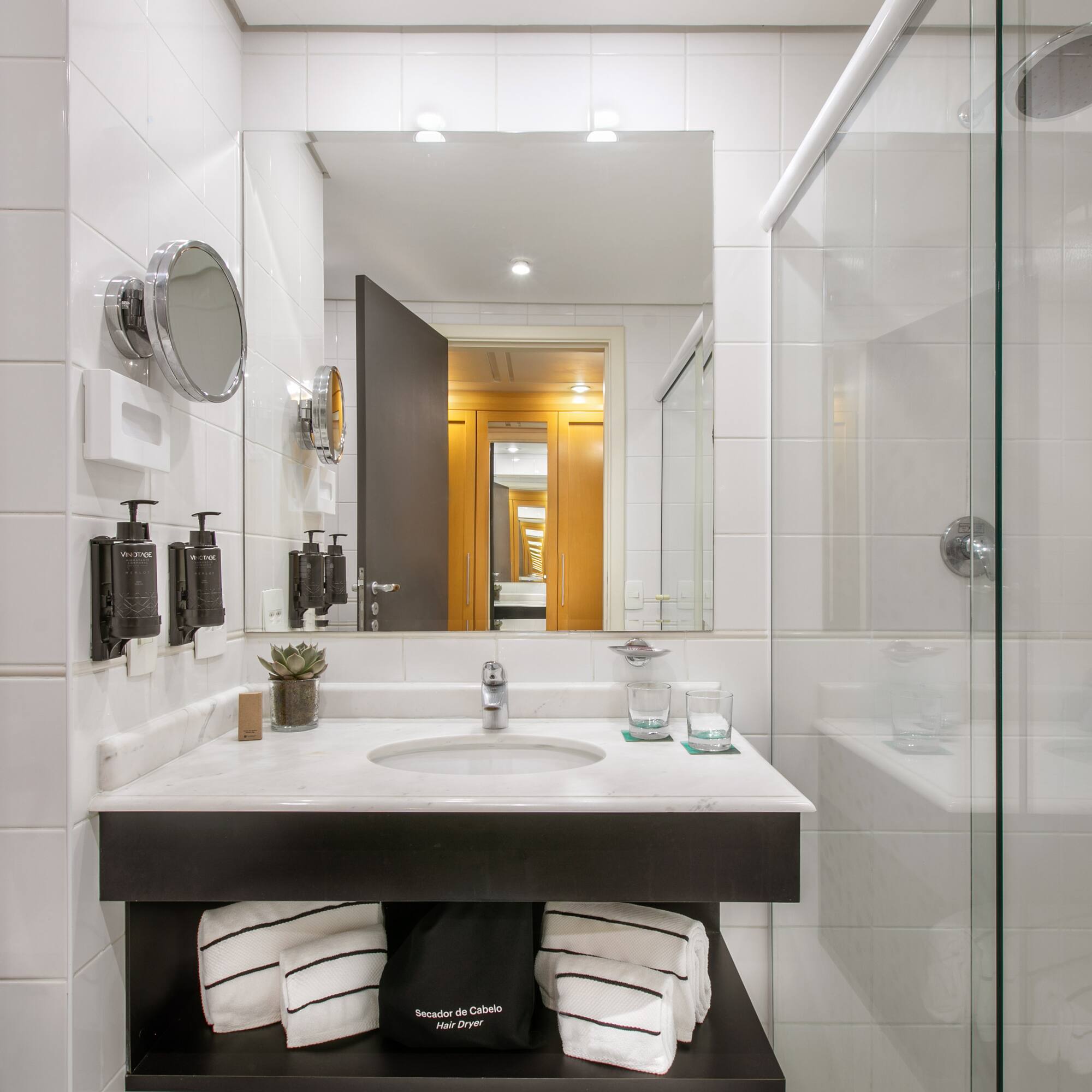 a bathroom with a mirror and a sink