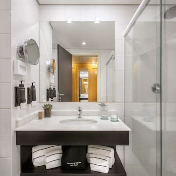 a bathroom with a mirror and a sink