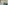 a blue couch in a room with a table and a mirror