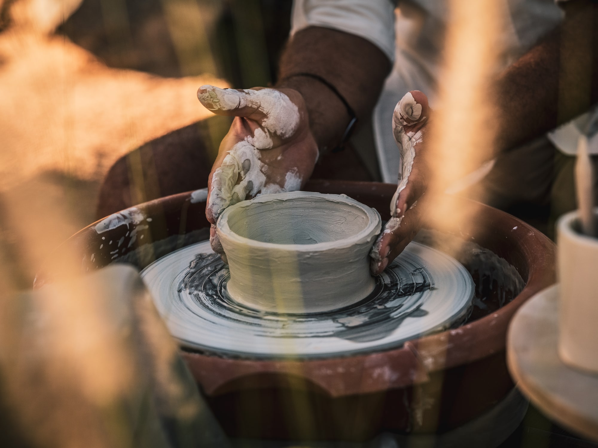 a person working on a pottery wheel