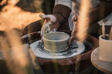 a person working on a pottery wheel