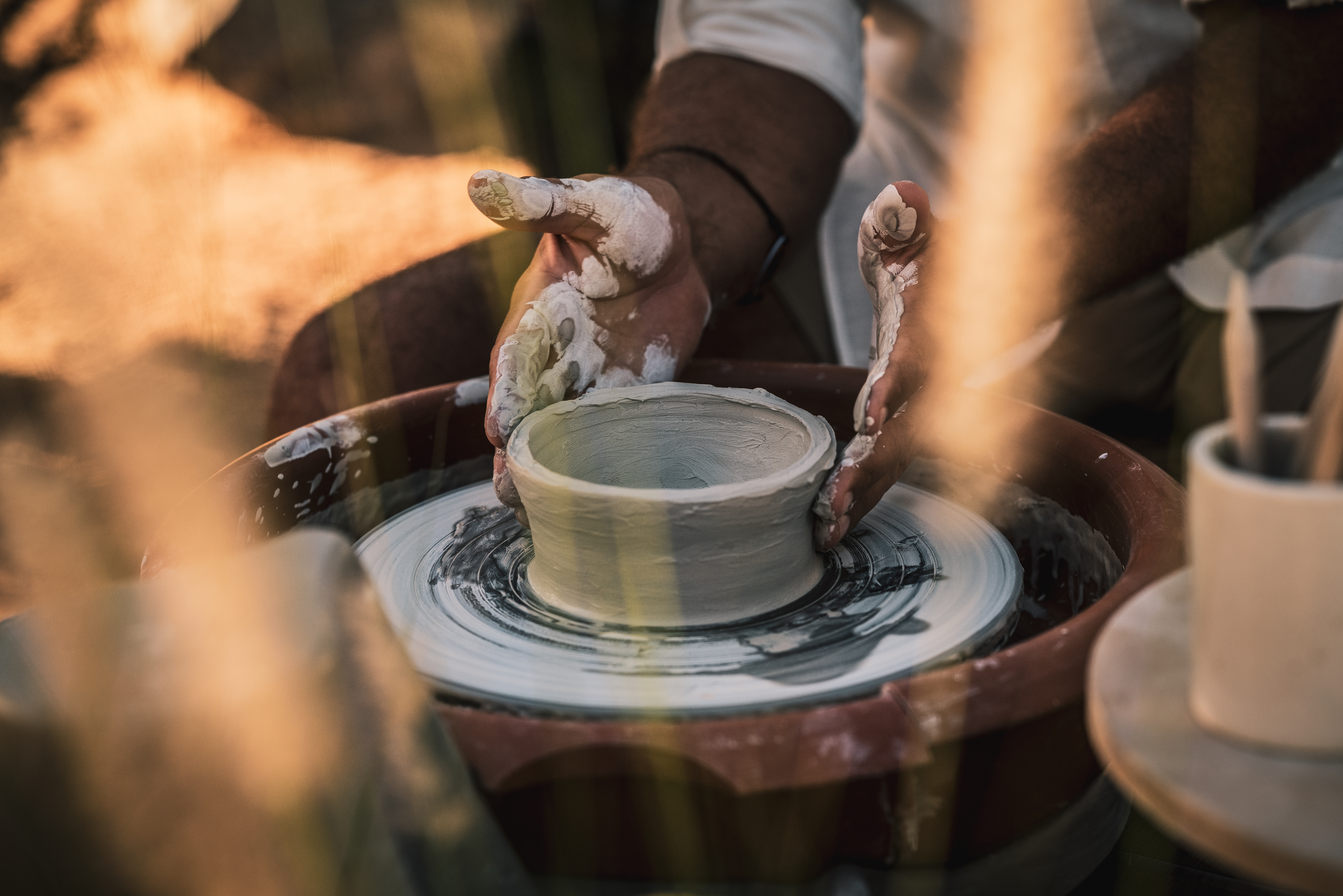 a person working on a pottery wheel