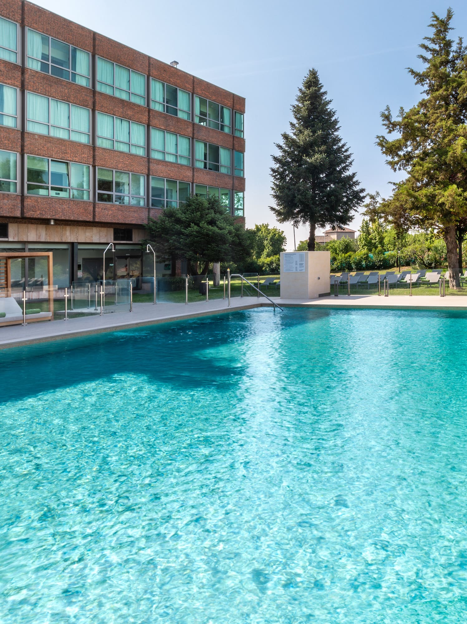 a swimming pool in front of a building