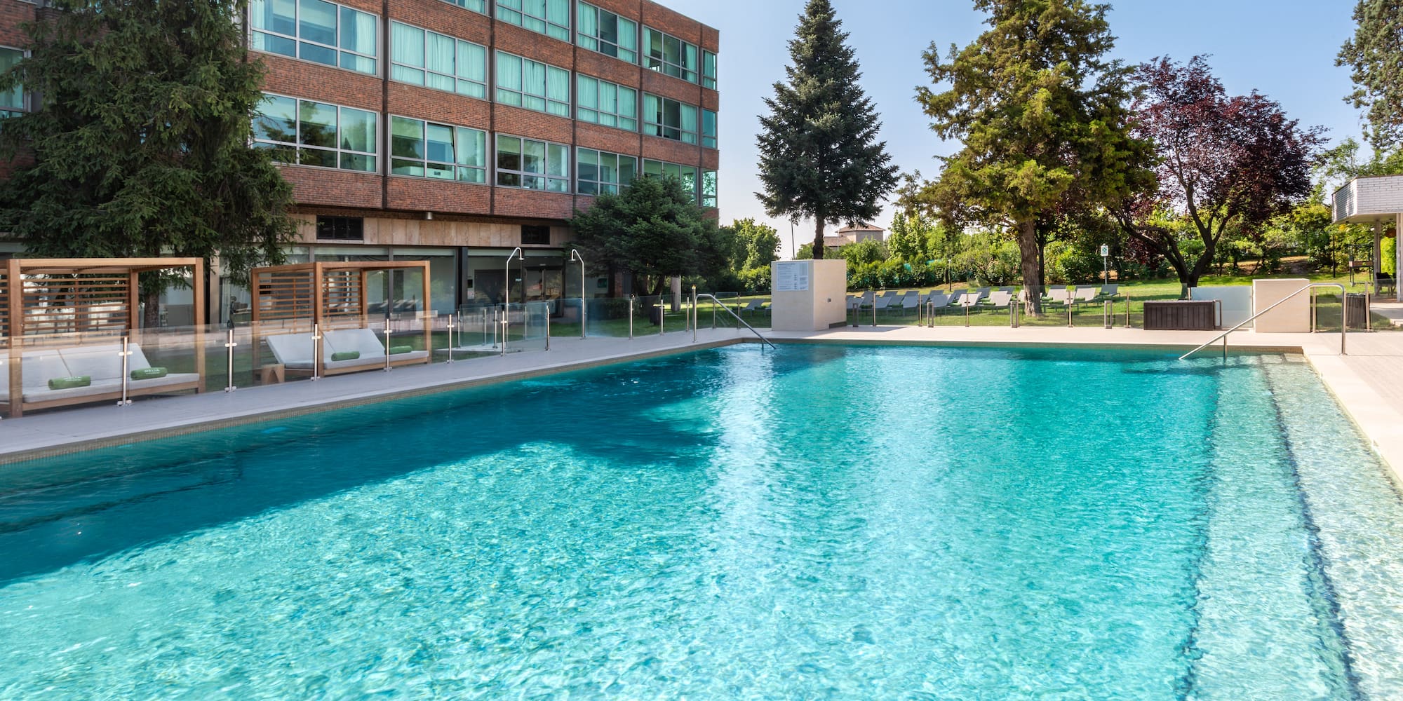 a swimming pool in front of a building