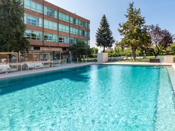 a swimming pool in front of a building