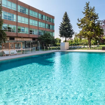 a swimming pool in front of a building